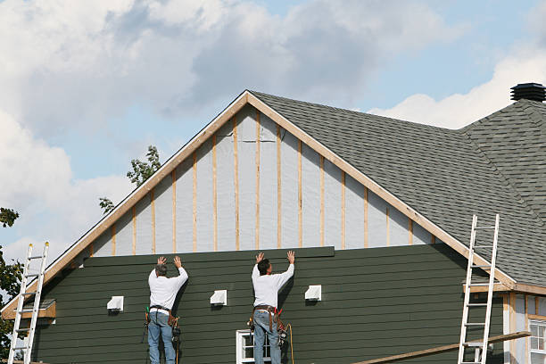 Professional Siding Repair technician working in New Paris, IN